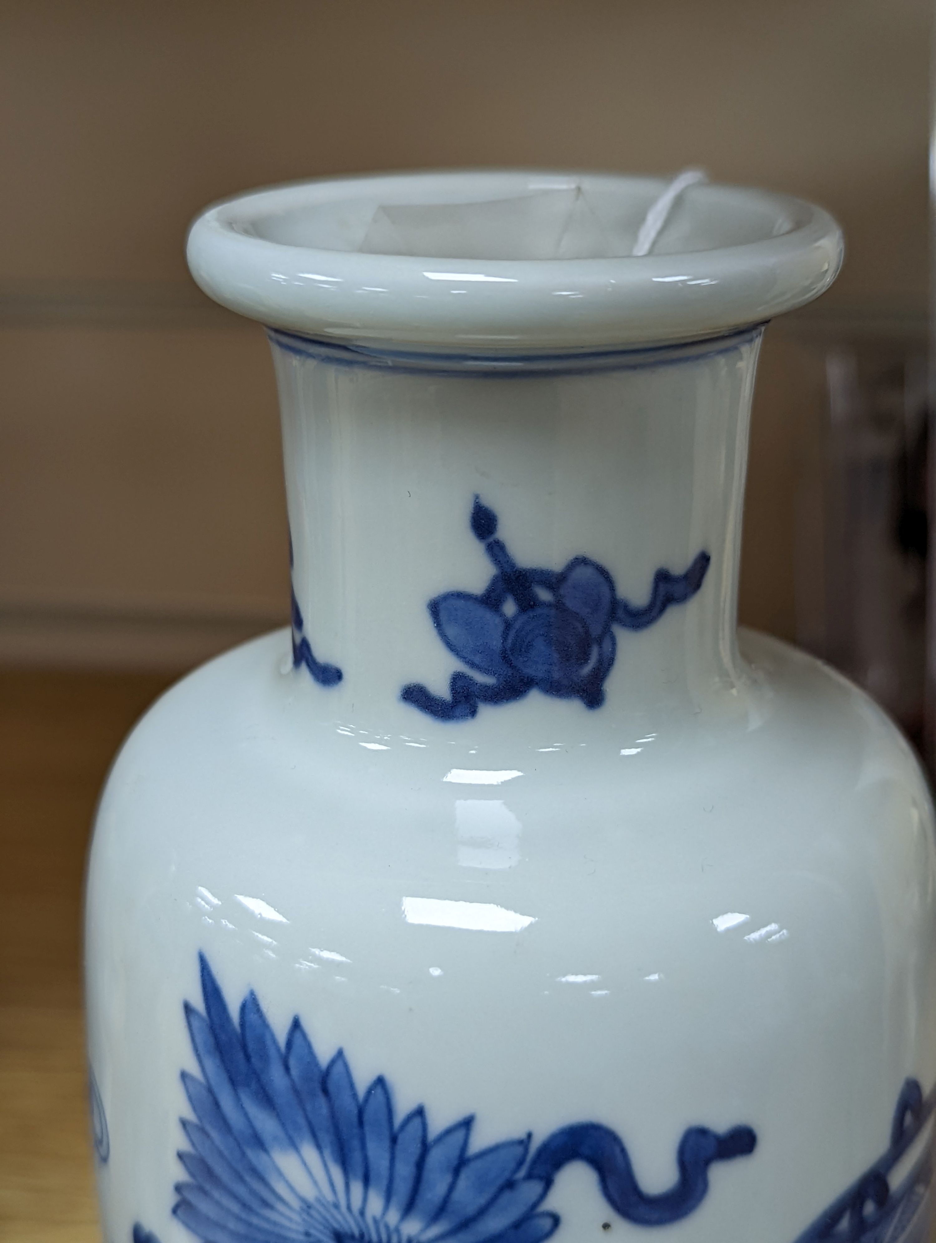 A Chinese blue and white ‘Antiques’ vase, 19.5 cms high.